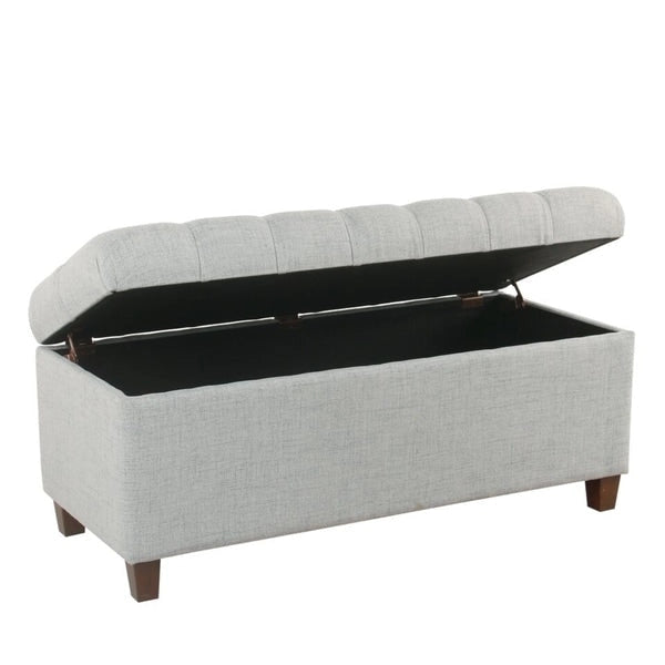 Banc de rangement capitonné à boutons avec couvercle à charnières et pieds en bois